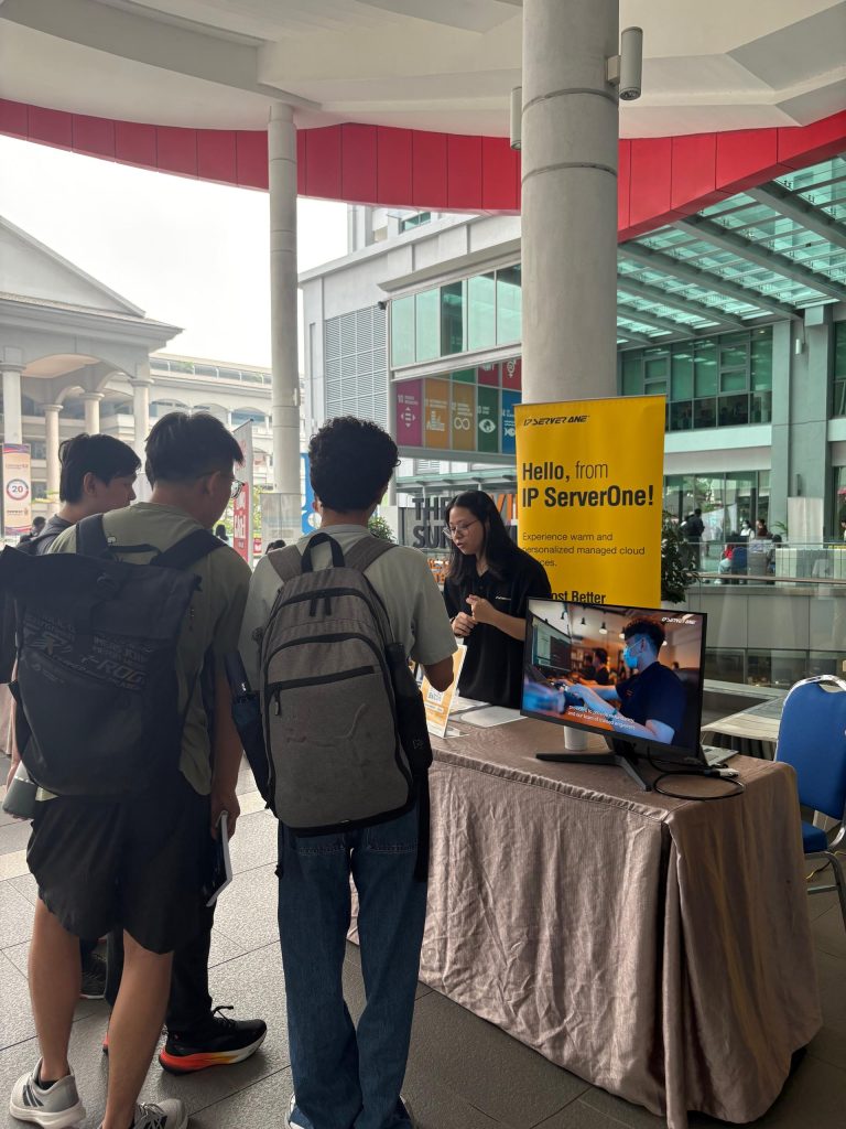 An IP ServerOne team member engaging with Sunway University students at the recruitment booth on Level 1, discussing career and internship opportunities in cloud computing.