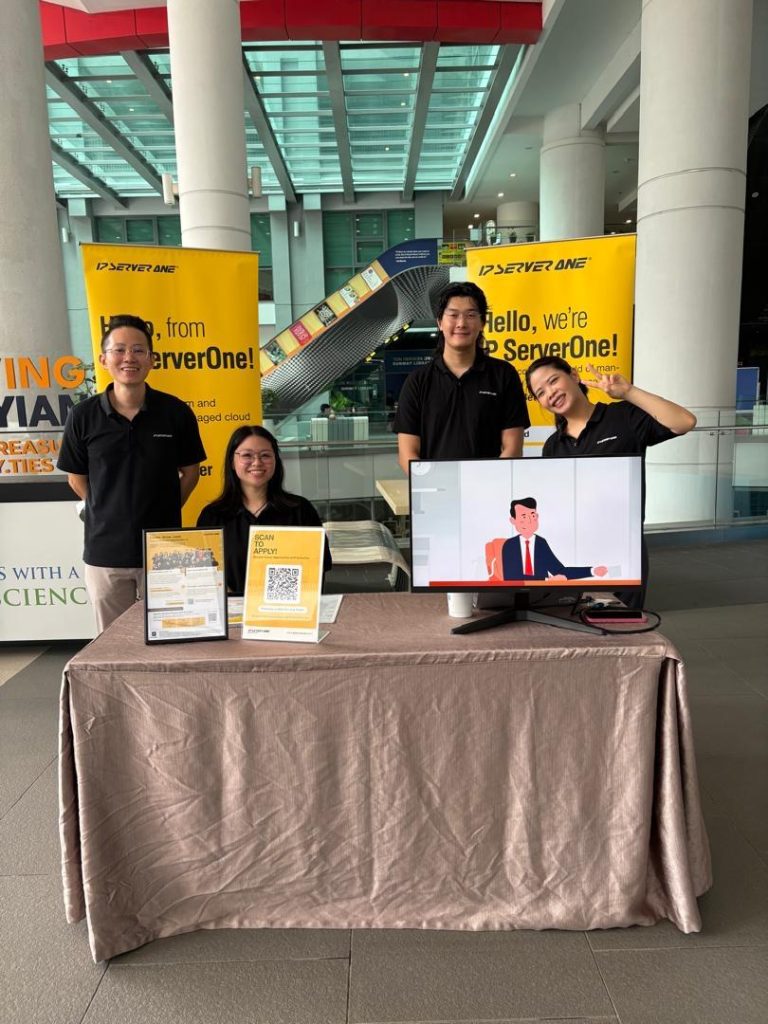 IP ServerOne team members posing at the recruitment booth on Level 1 of Sunway University during IABS 2026, engaging students on career and internship opportunities in cloud computing and AI.